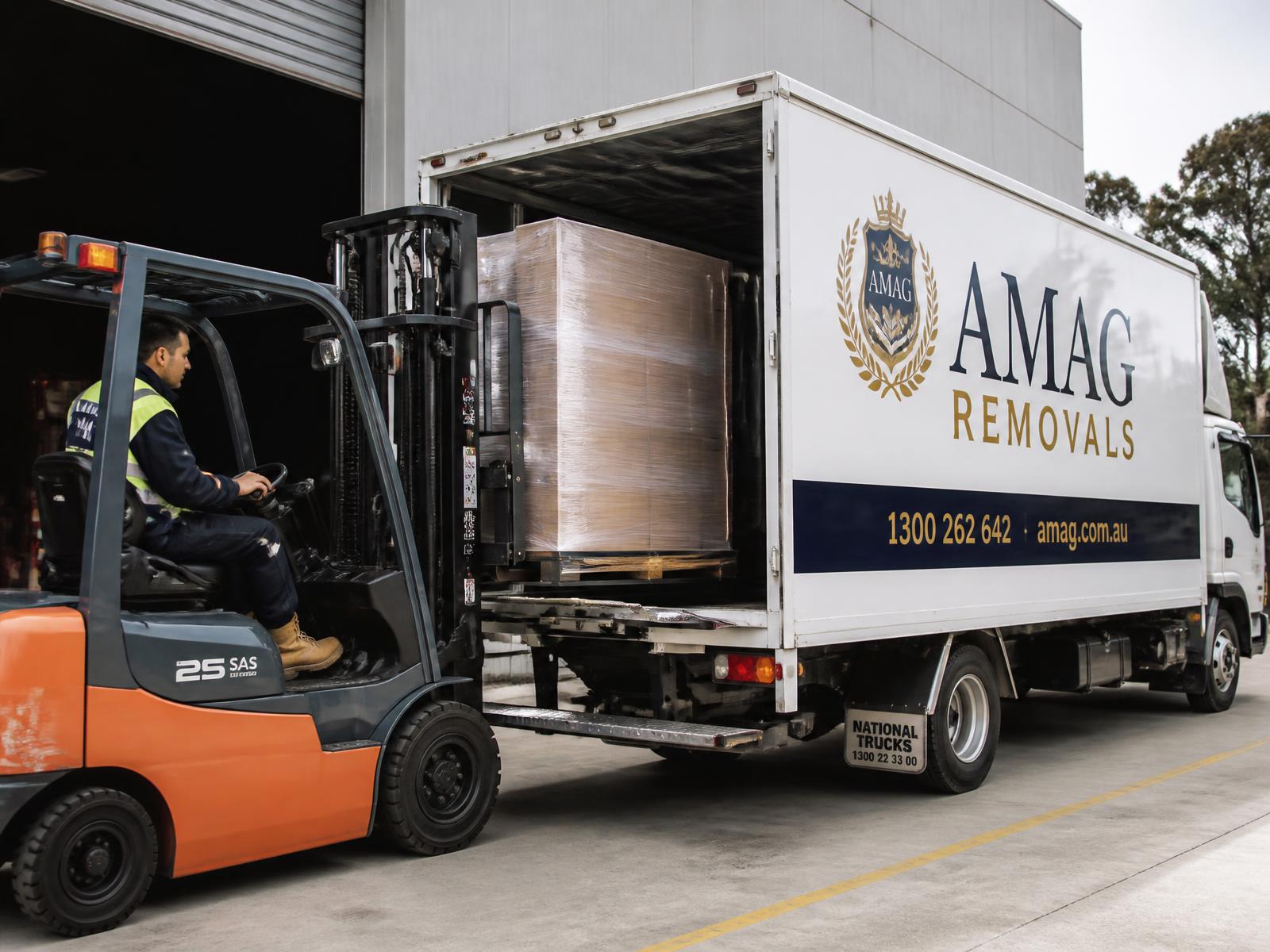 Forklift loading pallets at AMAG dock