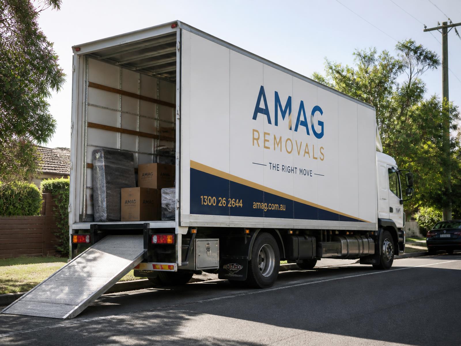 AMAG 8-tonne white pantech truck on a Melbourne street